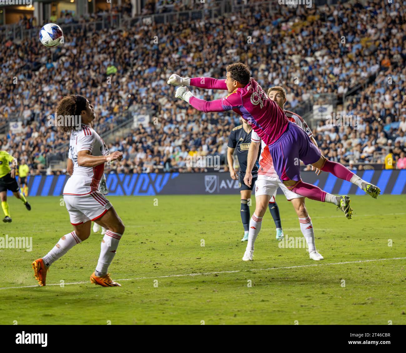Jacob Jackson New England Revolution goalkeeper punches the ball away during an MLS match against the Philadelphia Union - Major League Soccer footballers playing on the pitch in the USA / United States Credit: Don Mennig / Alamy News Stock Photo