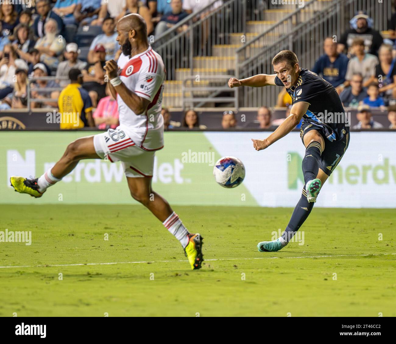 Mikael Uhre footballer for the Philadelphia Union strikes the ball for a shot on goal against the New England Revolution during an MLS soccer match. Action on the pitch of a Major League Soccer game in the USA / United States  Credit: Don Mennig / Alamy News Stock Photo