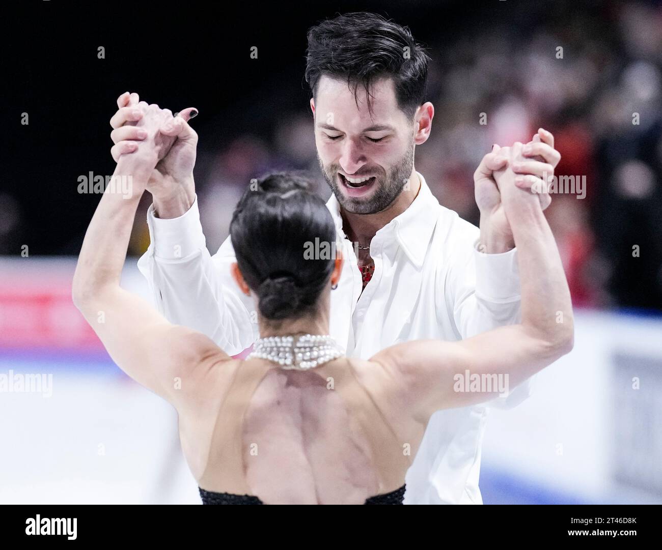 Deanna StellatoDudek and Maxime Deschamps of Canada react during the