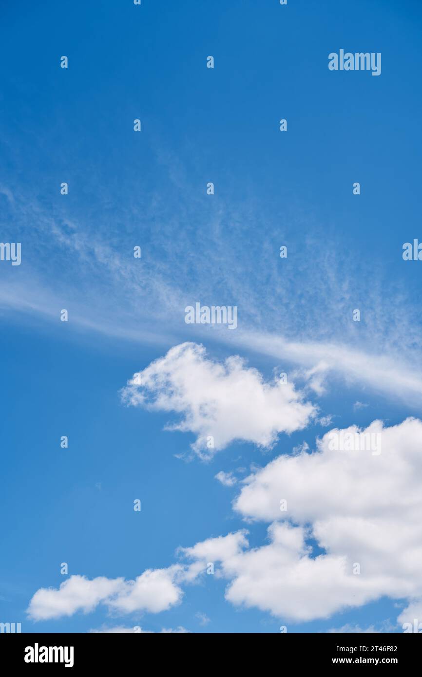White cumulus clouds on a bright blue sunny sky Stock Photo - Alamy