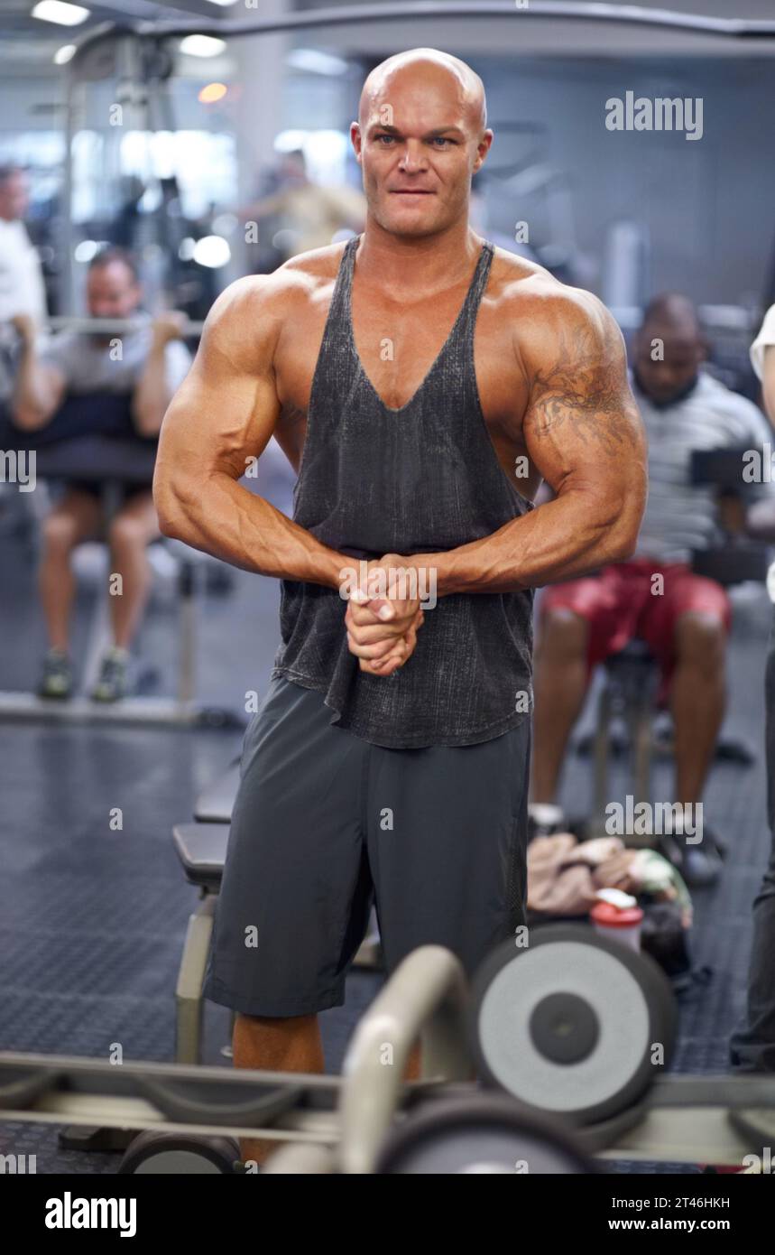 Man, arm flex and mirror at gym with fitness, workout and exercise of