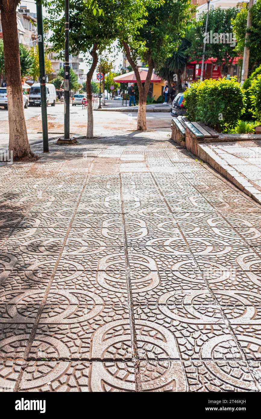 Stamped concrete pavement cobblestones pattern, decorative appearance colors and textures of paving cobblestones tile on cement flooring in a city par Stock Photo