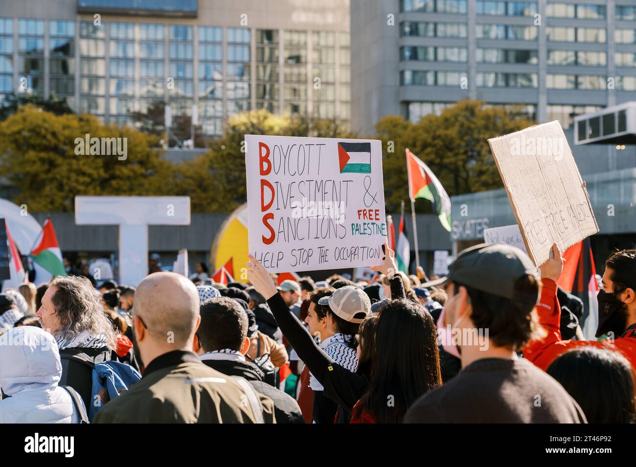 Toronto, Canada - 28 October 2023: Protesters march in the city, holding signs advocating for Boycott, Divestment, and Sanctions against the Stock Photo