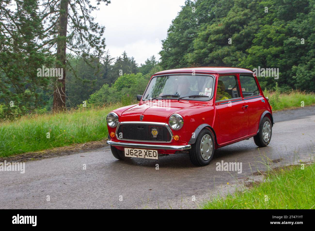 1992 90s nineties Rover Mini1000 City E, a small, two-door, four-seat car, developed as ADO15, and produced by the British Motor Corporation (BMC); arriving at Holker Hall vintage and classic car show, UK Stock Photo