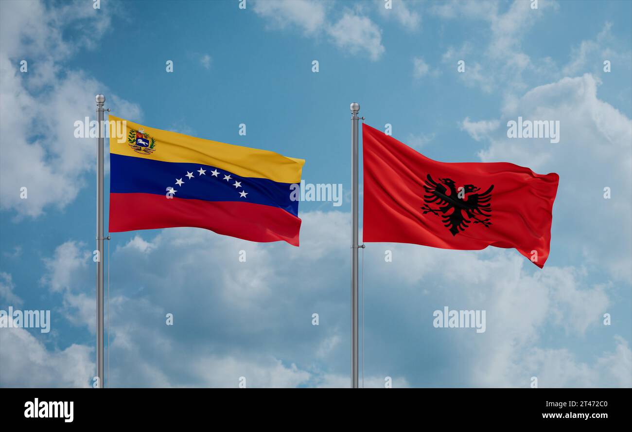 Venezuela and Albania flags waving together in the wind on blue cloudy ...