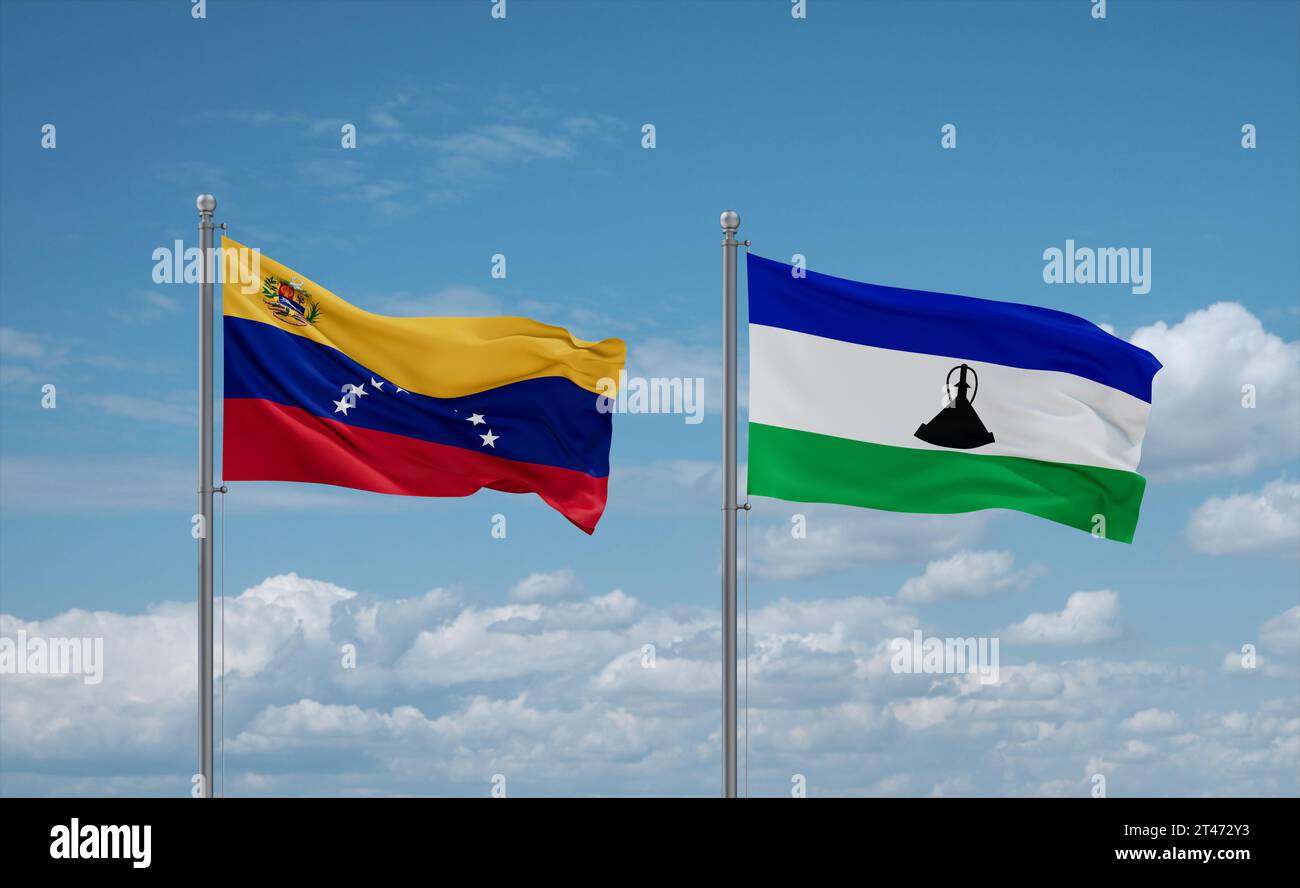 Lesotho and Venezuela flags waving together in the wind on blue cloudy ...