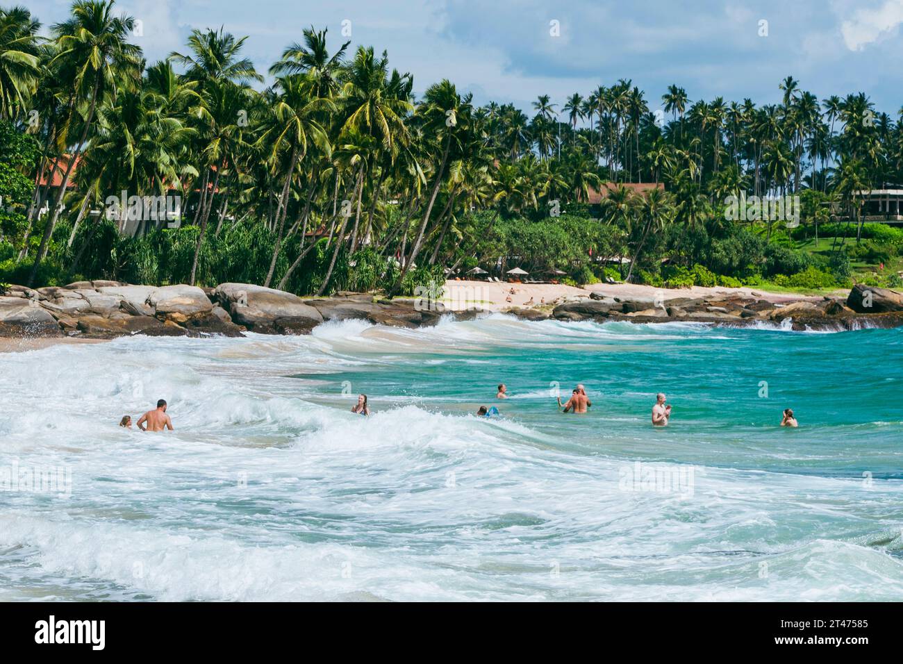 Strong Beach People enjoy the strong waves at Silent Beach in Sri Lanka Stock Photo ...
