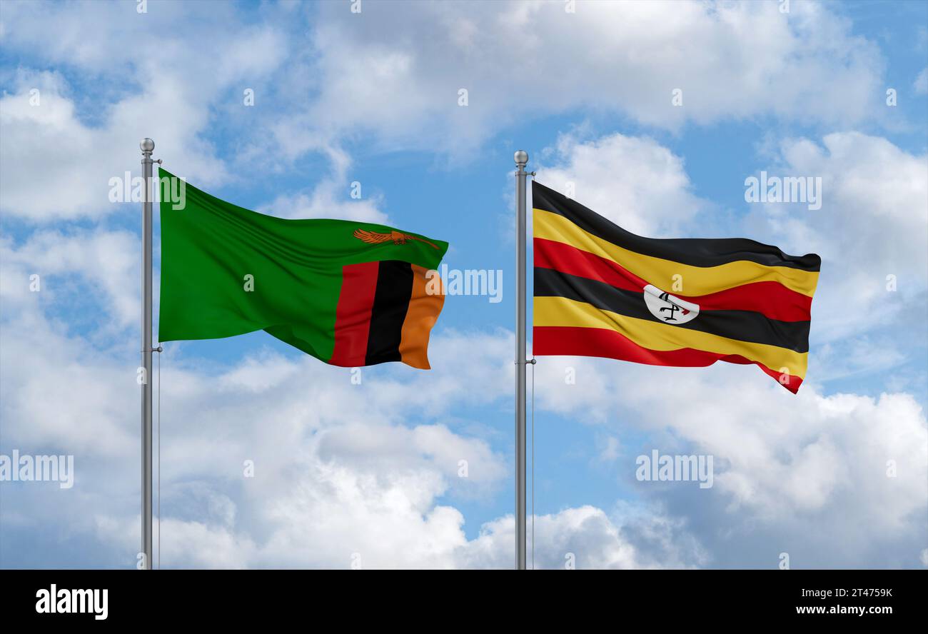 Republic of Uganda and Zambia flags waving together in the wind on blue ...