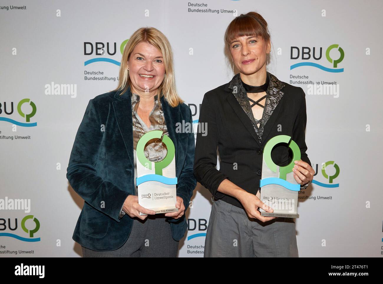 29 October 2023, Schleswig-Holstein, Lübeck: Award winners Dagmar Fritz-Kramer (l), Managing Director Bau-Fritz GmbH & Co.KG, and Friederike Otto, Professor Grantham Institute Climate Change and the Environment Imperial College London, UK, stand with their awards at a press event . The Deutsche Bundesstiftung Umwelt (DBU) awards the German Environmental Prize every year in recognition of achievements that have contributed or will contribute in the future to the protection of the environment, climate, species and resources. The environmental prize is endowed with a total of 500,000 euros. Phot Stock Photo