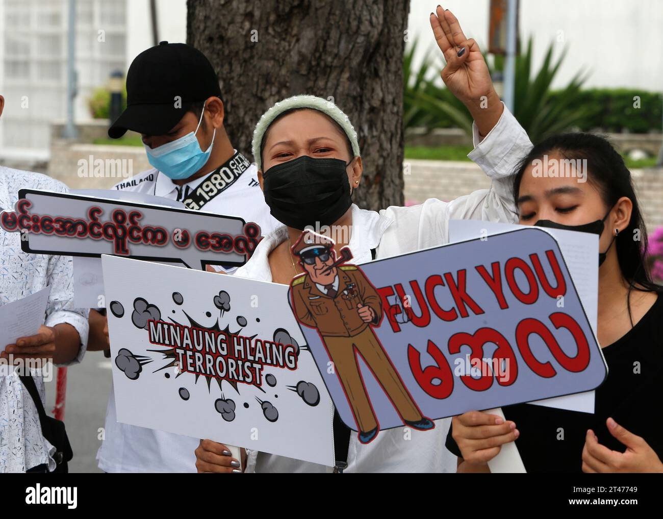 Bangkok, Thailand. 29th Oct, 2023. (EDITOR'S NOTE: Image depicts profanity) Myanmar nationals living in Thailand flash the three-finger salute and hold placards during a protest on campaign 1000 days since coup in Myanmar in front of United Nations building. The Myanmar military seized power in February 2021. (Photo by Chaiwat Subprasom/SOPA Images/Sipa USA) Credit: Sipa USA/Alamy Live News Stock Photo
