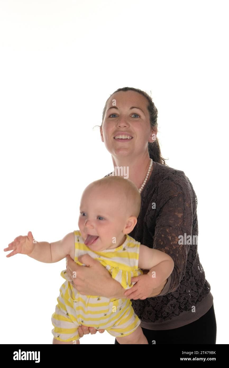 Mother and baby happy standing swinging in arms Stock Photo Alamy