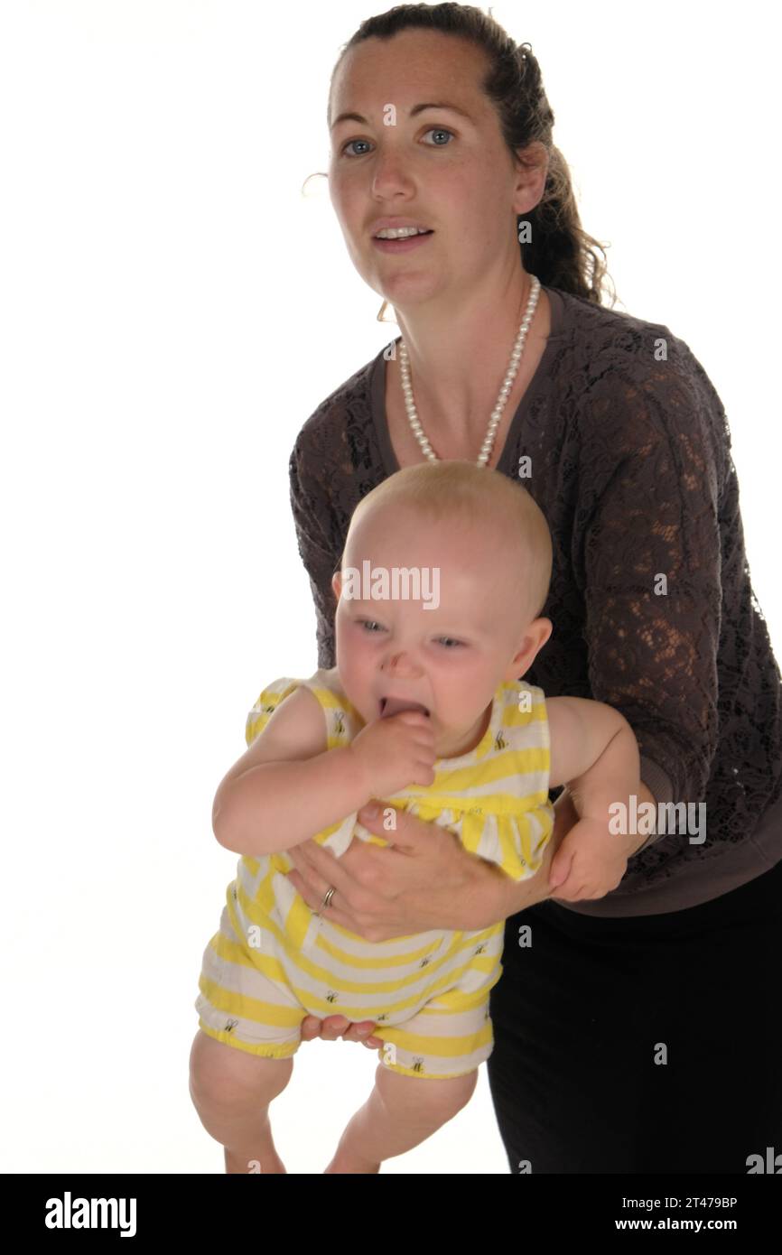 Mother and baby happy standing swinging in arms Stock Photo Alamy
