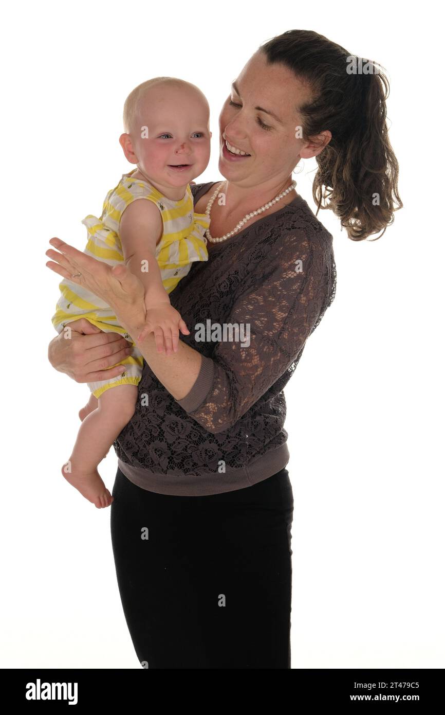 Mother and baby happy standing swinging in arms Stock Photo Alamy