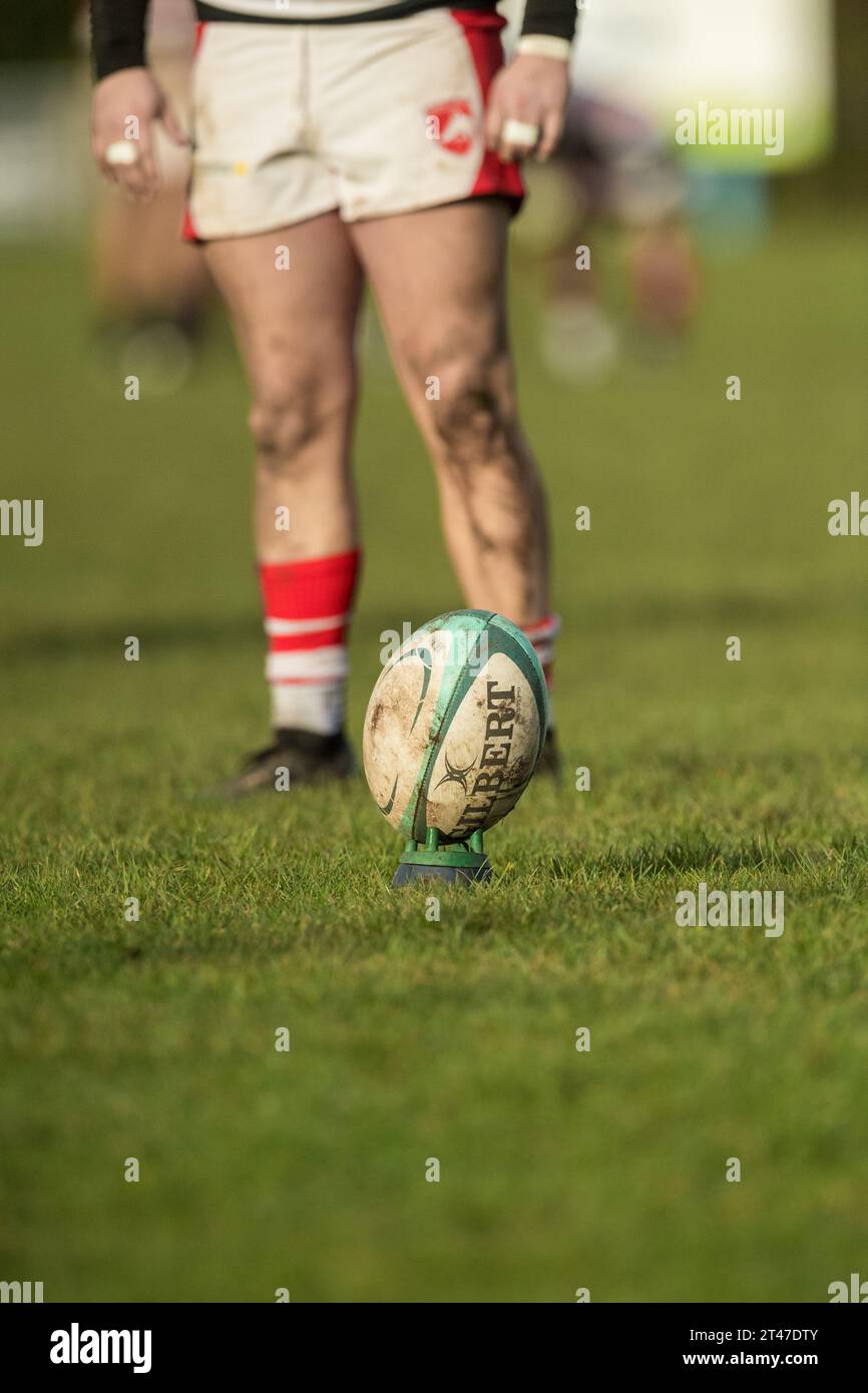 Gilbert rugby union football on a stand ready to be kicked Stock Photo