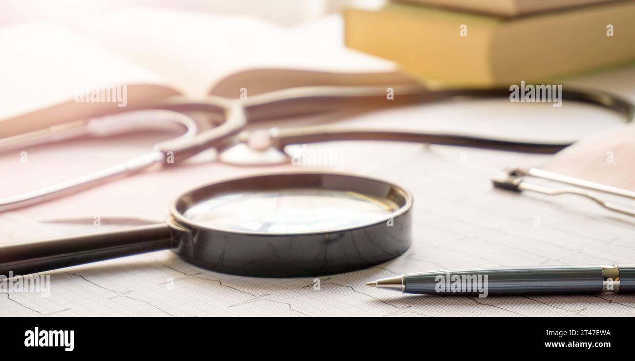 Medical examination concept with stethoscope and magnifier Stock Photo -  Alamy