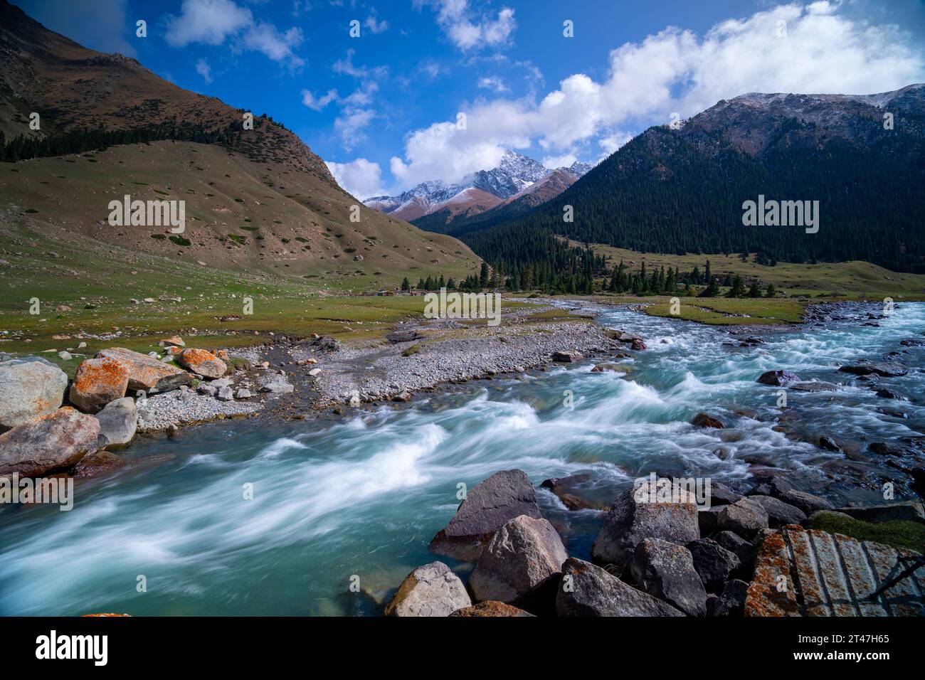 river flows in a valley in Kyrgyzstan Stock Photo