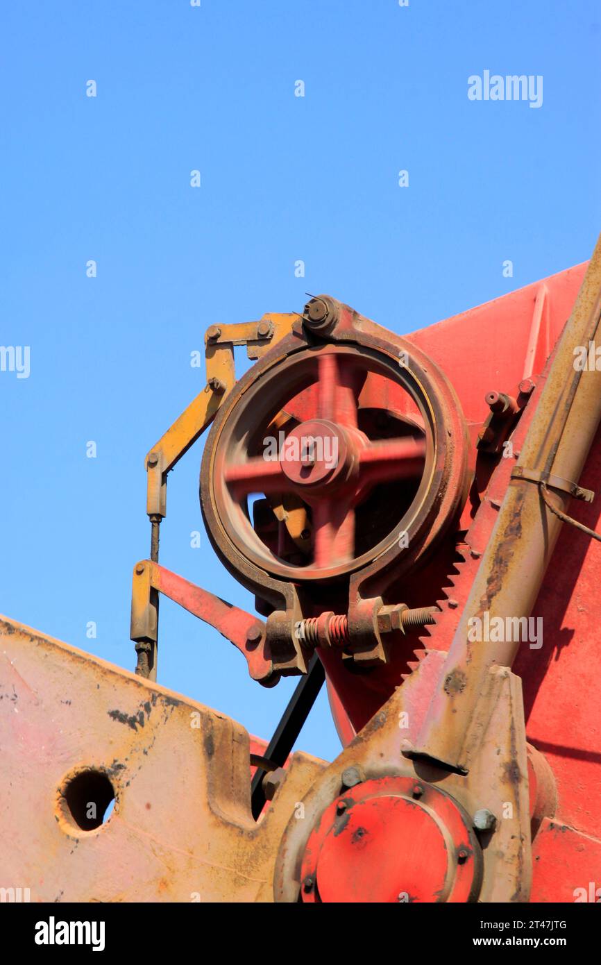 Beam pumping unit rotating wheels, closeup of photo Stock Photo