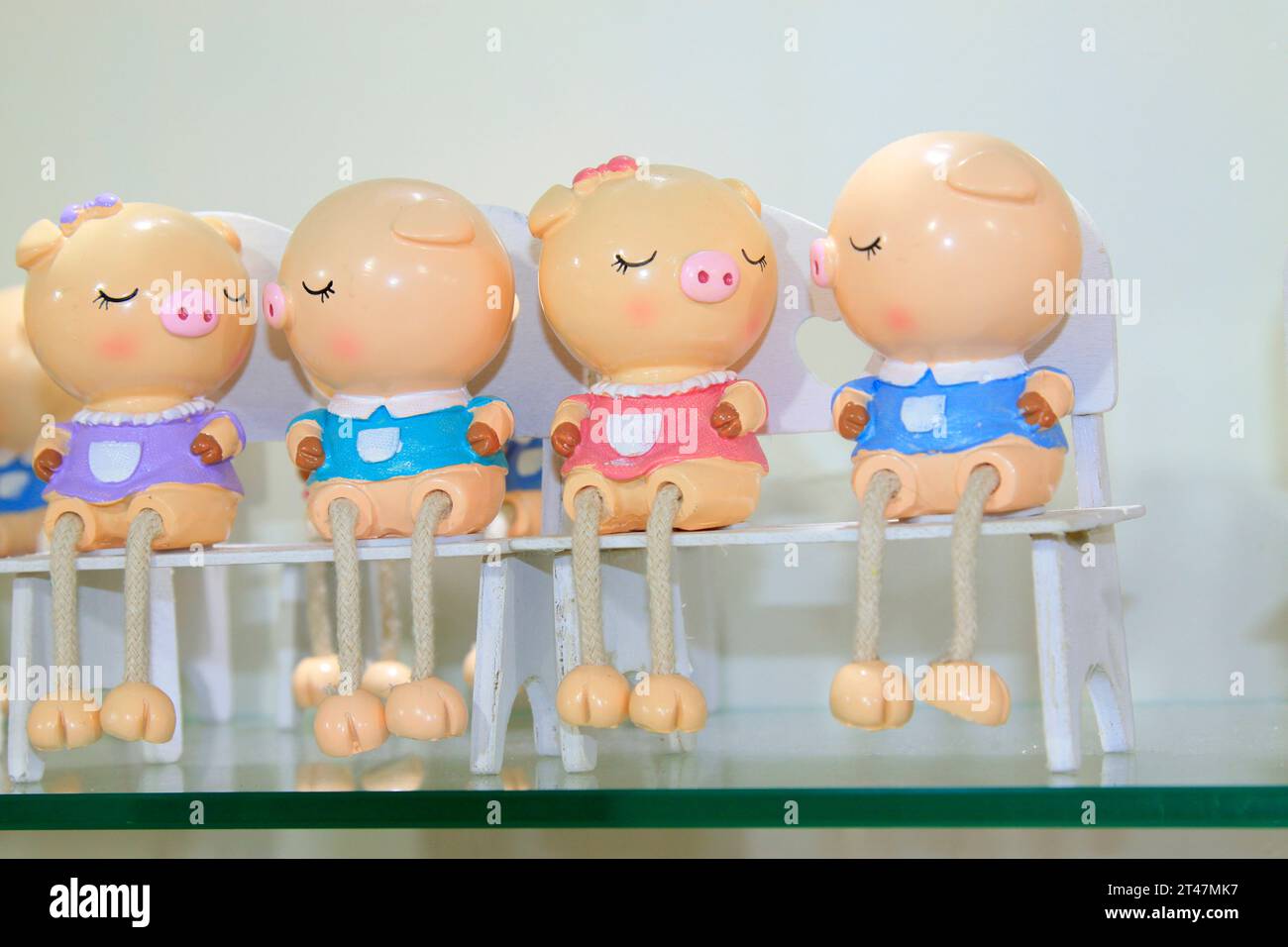 cartoon little piggy formative dolls on the store shelves Stock Photo