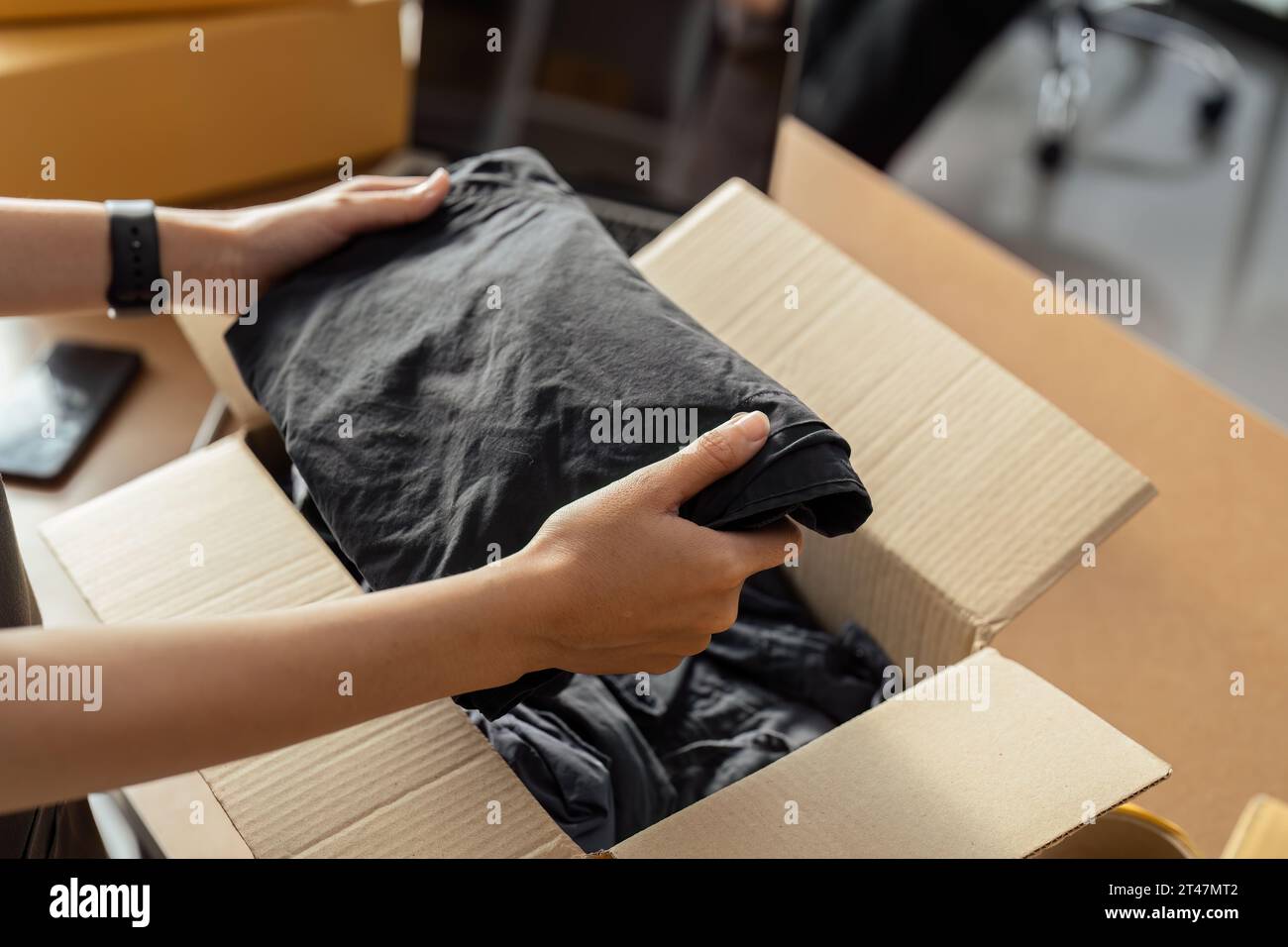 Female owner online store small business entrepreneur packing package ...
