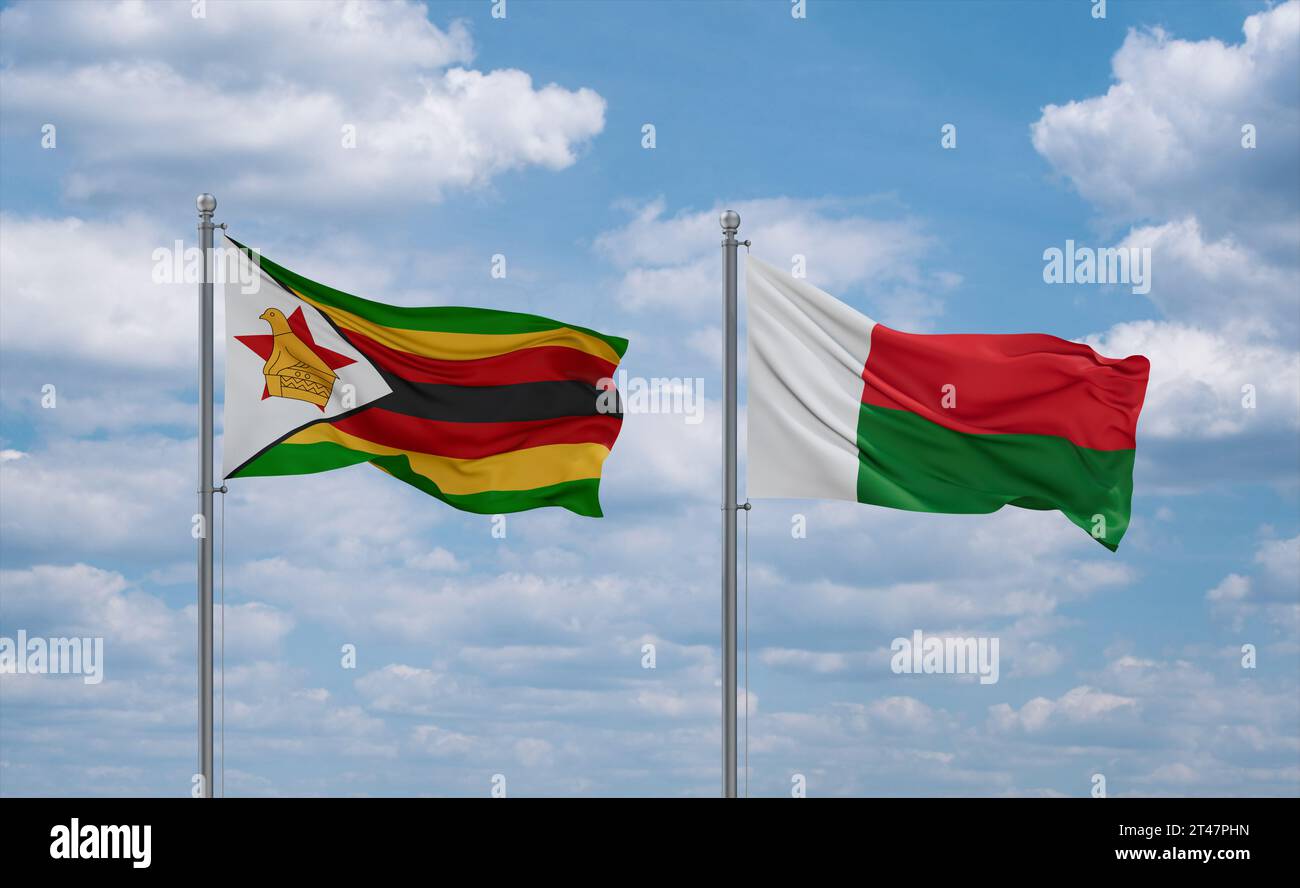 Madagascar and Zimbabwe flags waving together on blue cloudy sky, two ...