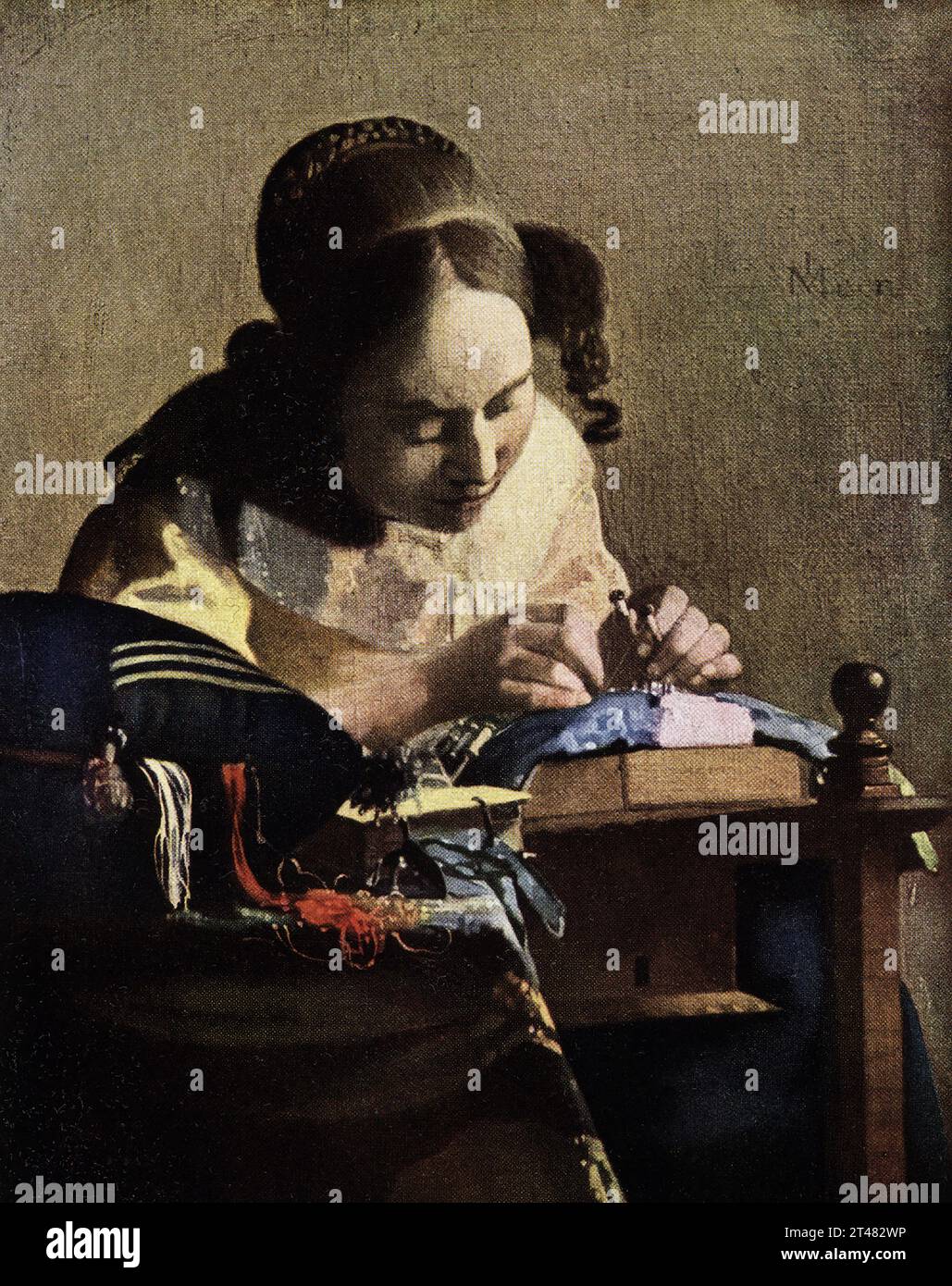 The 1916 caption reads: “Vermeer of Delft 1632-1675 Dutch School The Lace Maker La Dentelliere in Louvre J v Meer -first three letters being intertwined. Painted in oil on canvas. 9.5 in square Johannes Vermeer was a Dutch Baroque Period painter who specialized in domestic interior scenes of middle-class life. He is considered one of the greatest painters of the Dutch Golden Age along with Rembrandt Stock Photo