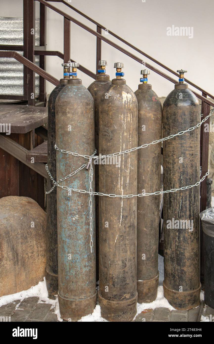 Closeup of steel cylinders with compressed gas argon, carbon dioxide