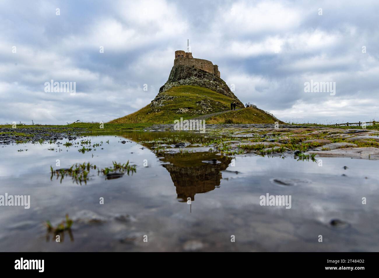 Holy Isle, United Kingdom. 28 October, 2023 Pictured: Lindisfarne Castle reflected in a puddle on Holy Isle in Northumberland. Credit: Rich Dyson Stock Photo