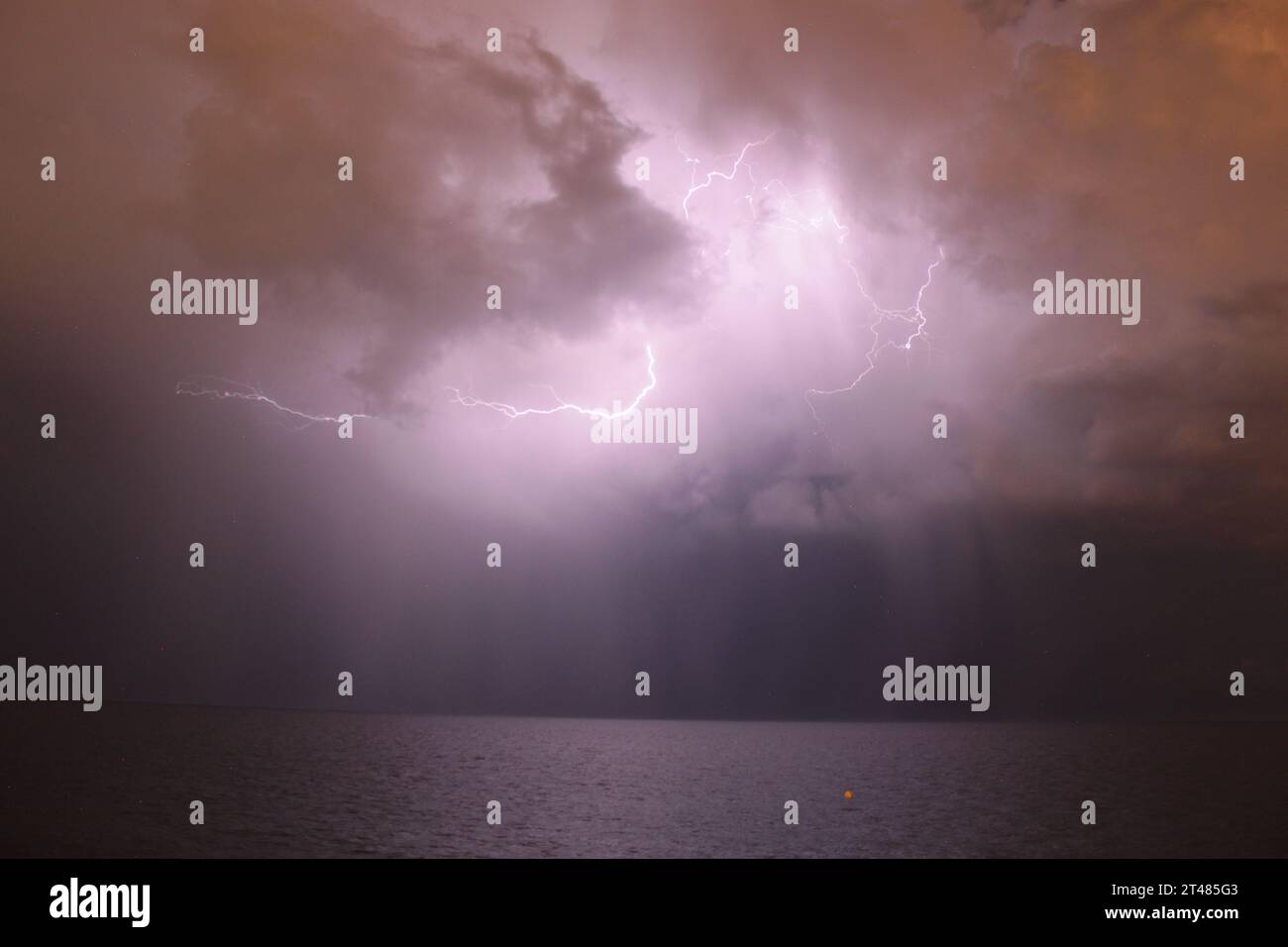 image of some lightning air air during a storm over the sea on a dark ...