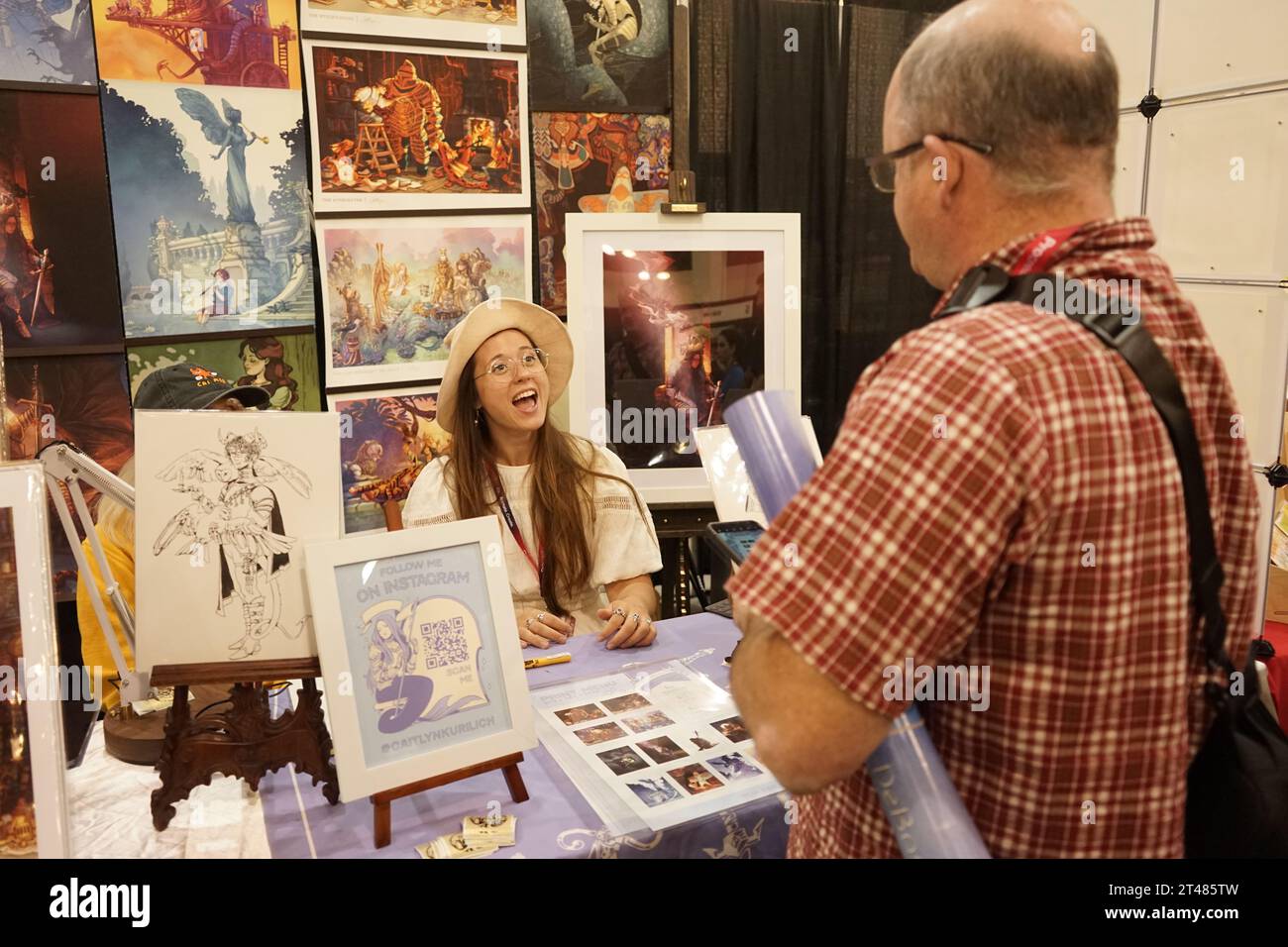 Pasadena, USA. 28th Oct, 2023. A visitor talks with an artist at the