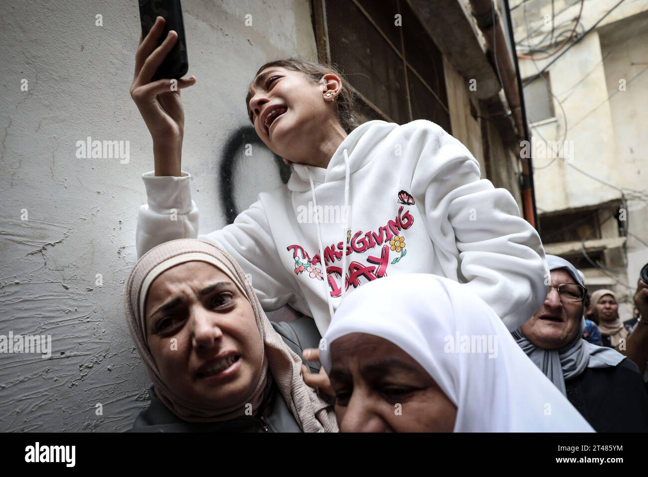 Nablus, Palestinian Territories. 29th Oct, 2023. A Palestinian girl cries while shooting the funeral of Naem Farran, 37, who was killed in an Israeli operation on Askar camp earlier this morning, near the West Bank city of Nablus. Credit: Ayman Nobani/dpa/Alamy Live News Stock Photo