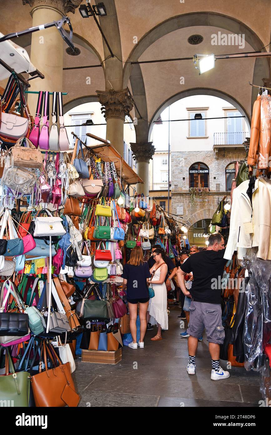 Florence, Italy. September 2023. Souvenir stalls with colorful handbags in Florence. High quality photo Stock Photo