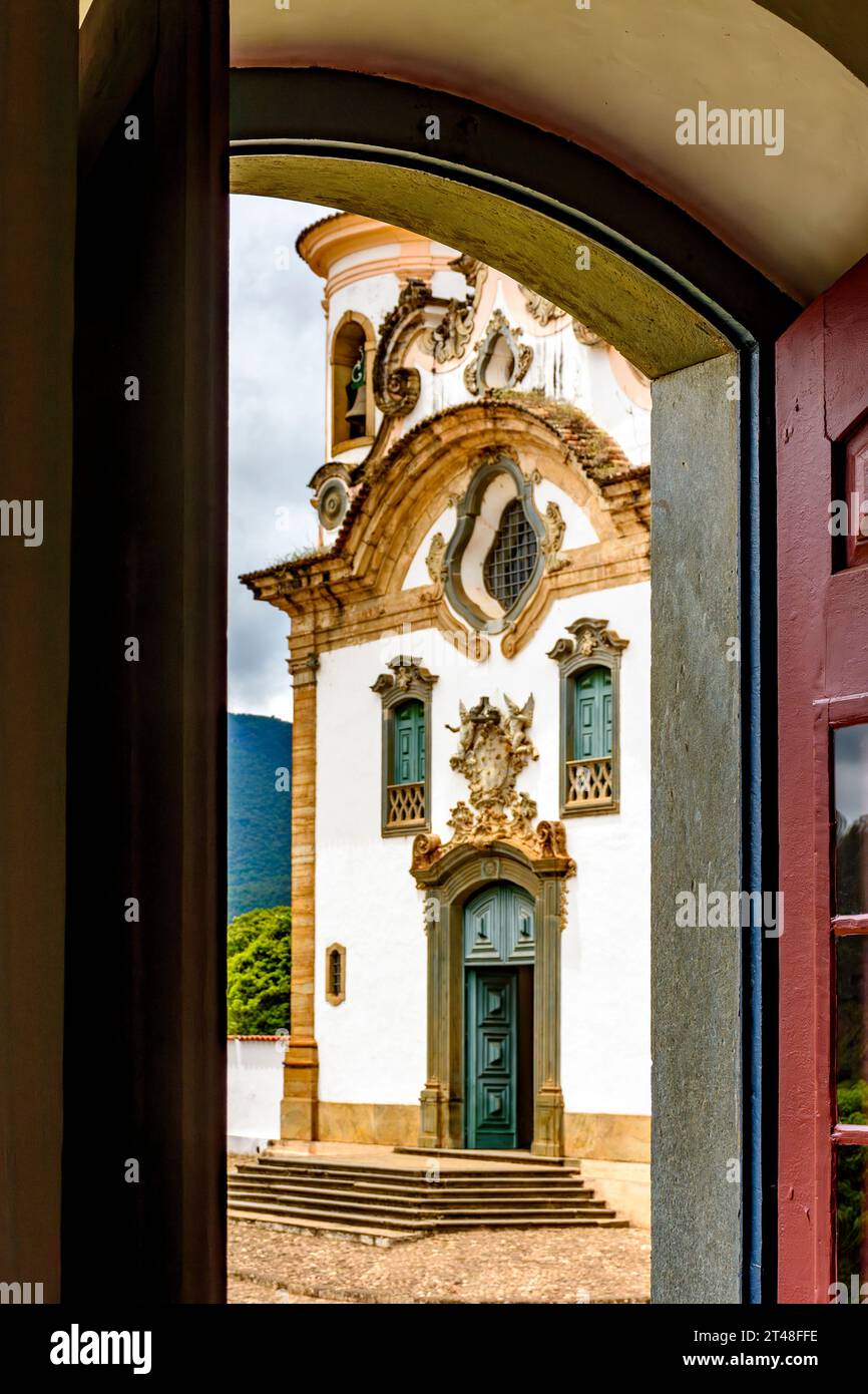 Baroque church facade seen through the window in the city of Mariana in the state of Minas Gerais Stock Photo