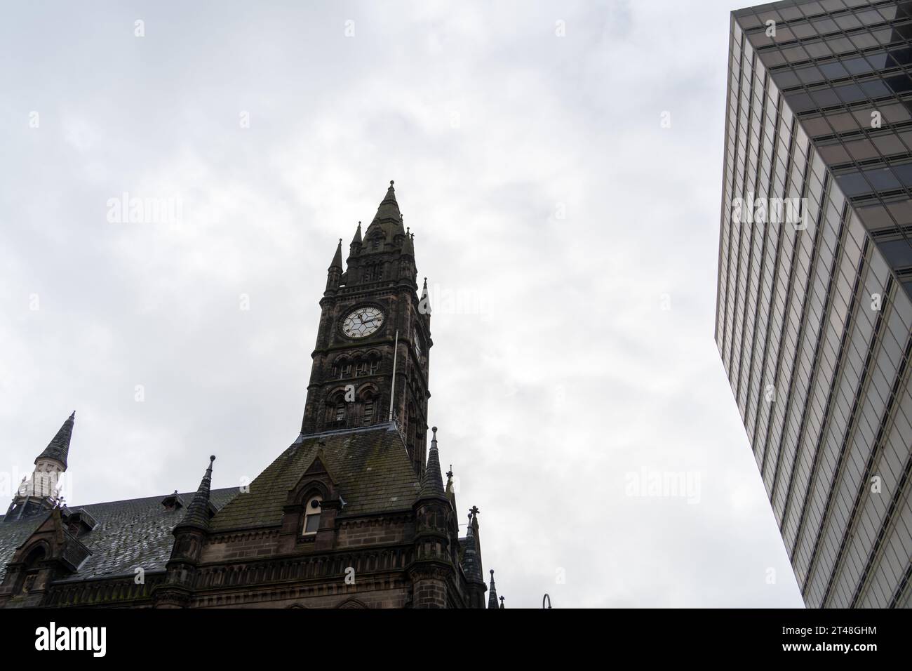 The clock tower of Middlesbrough Town Hall and the high rise Centre North East building - contrasting architecture in Middlesbrough, UK Stock Photo