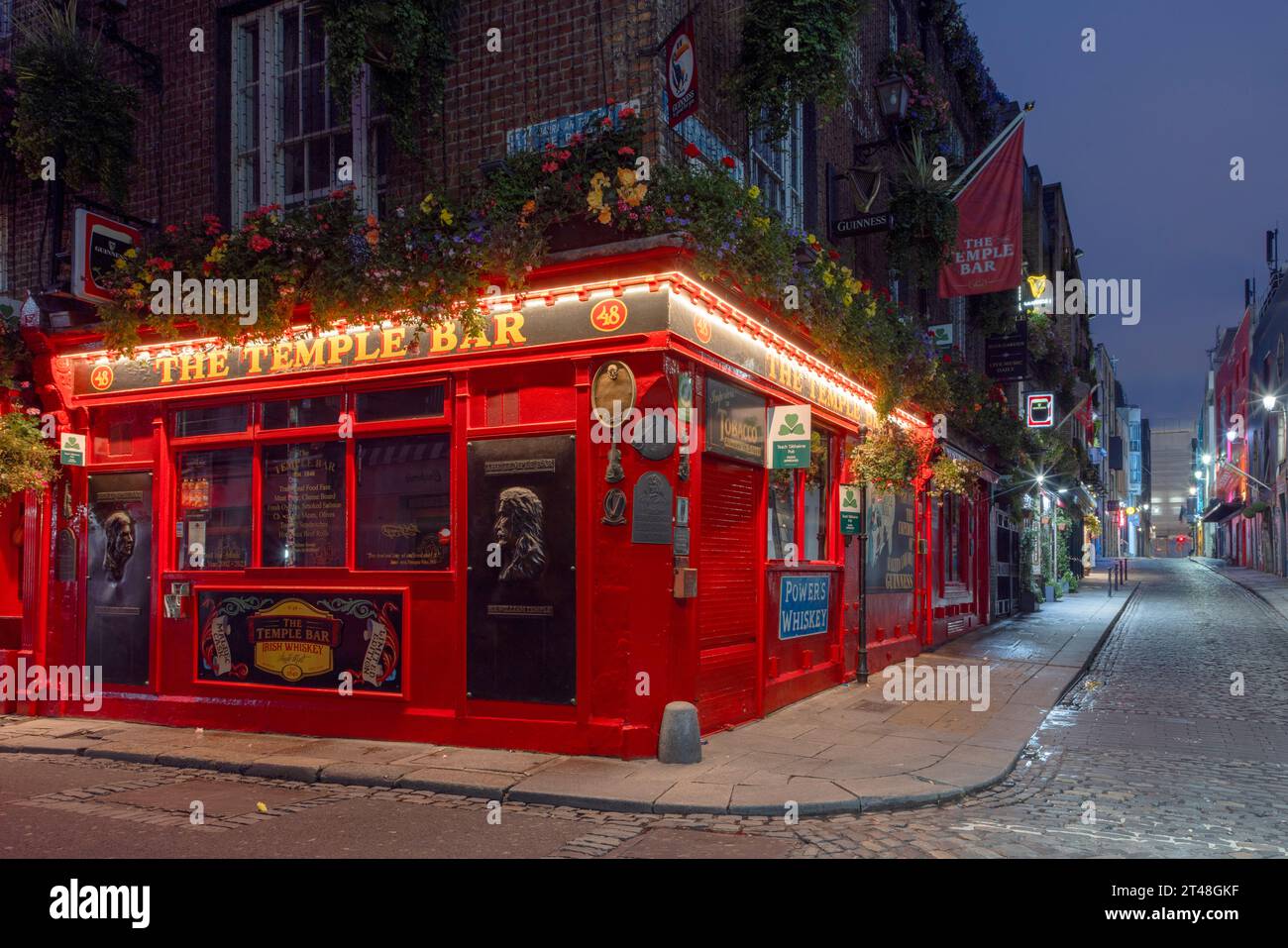 The Temple Bar Pub is a traditional Irish pub in Dublin, Ireland, famous for its live music, lively atmosphere, and iconic whiskey selection. Stock Photo