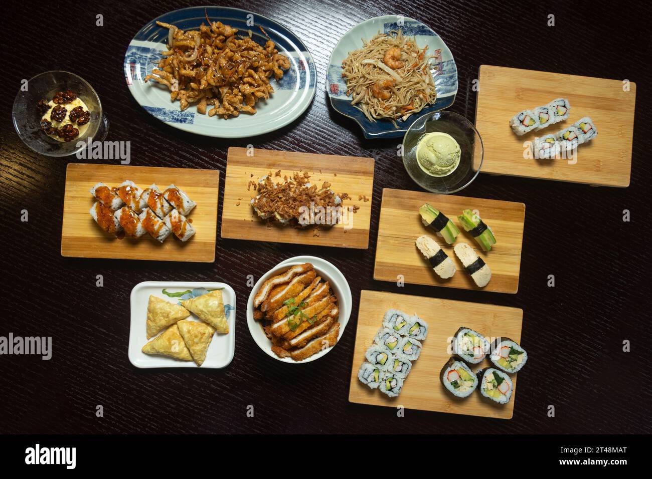 Table with a variety of Japanese food dishes Stock Photo