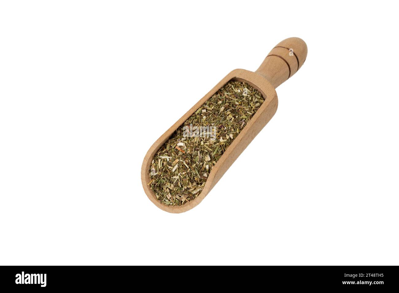 Dry Tansy Herb in latin Tanacetum vulgare in wooden scoop isolated on