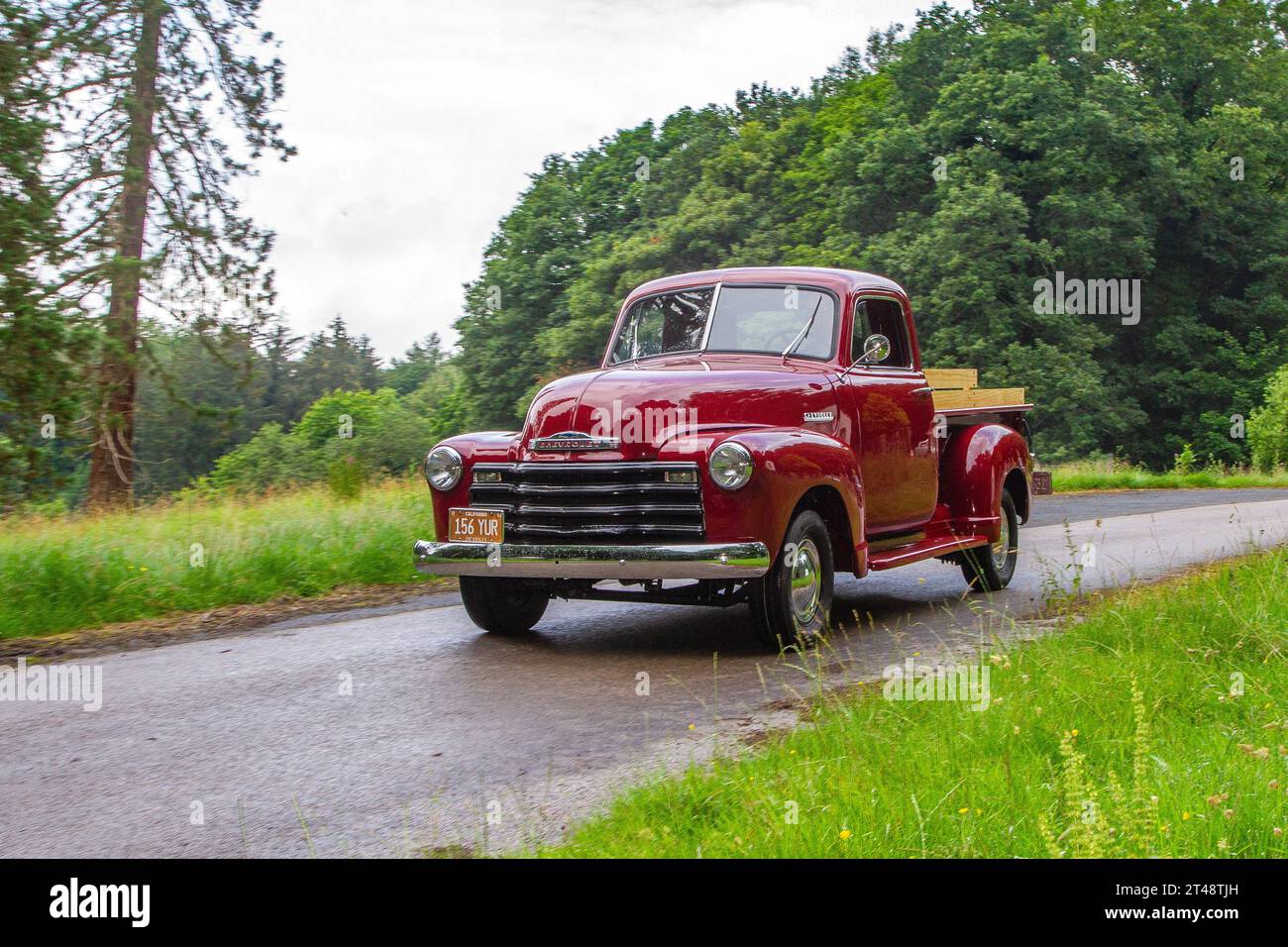 1951 50s fifties American Red Chevrolet Chevrolet Car Petrol 3859 cc; arriving at Holker Hall vintage and classic car show, UK Stock Photo