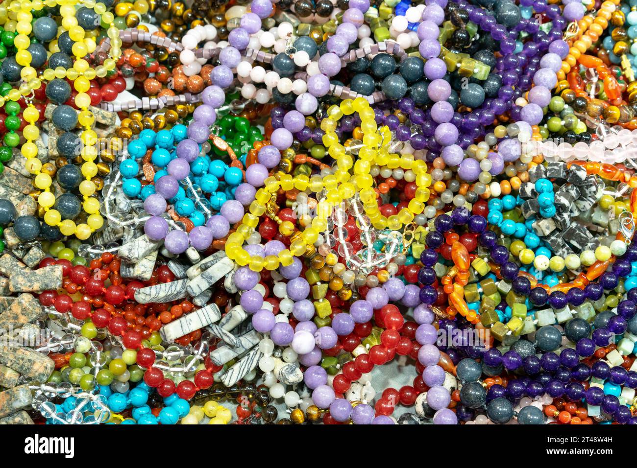 Beads made from various semi-precious stones. Jewelry background concept. Stock Photo