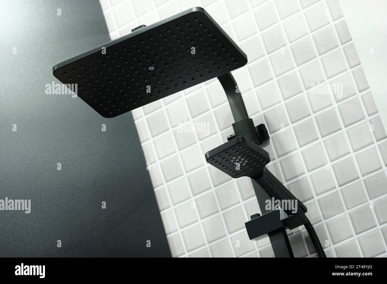 Black modern shower head on a shower column close-up Stock Photo - Alamy