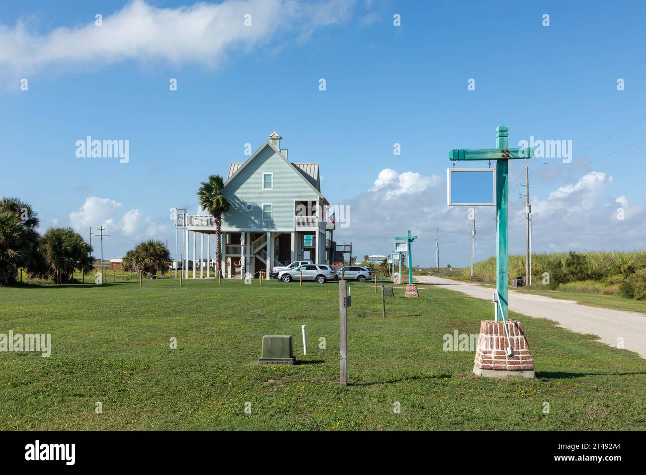 new beach houses at Port Bolivar on wooden stilts to protect against flooding, Texas, USA Stock