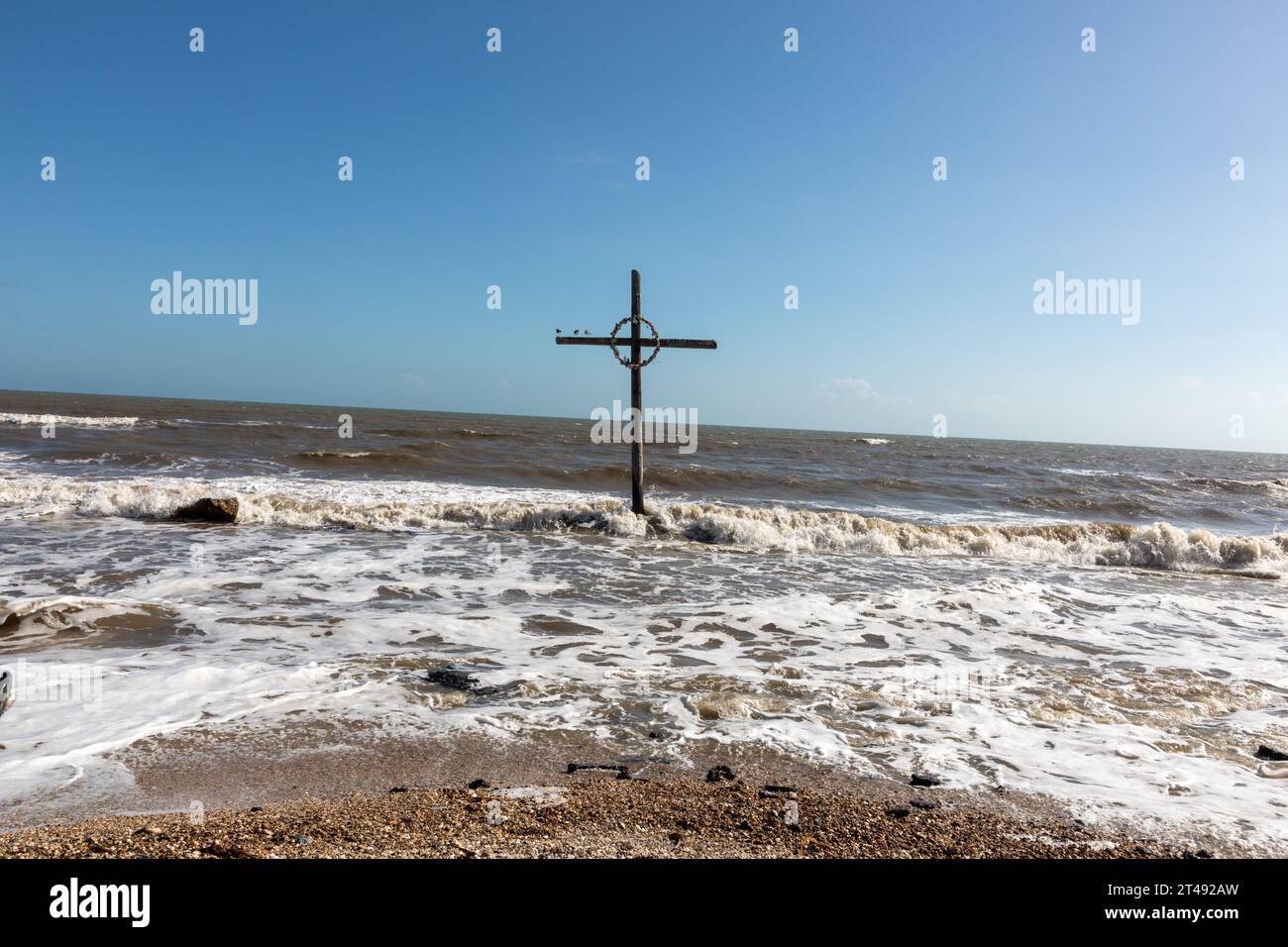 cross in the ocean at bolivar peninsula used also for burial at sea, Texas, USA Stock Photo