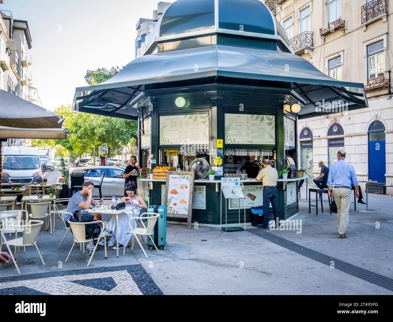 Outdoor cafe on Praça do Duque de Saldanha or Duke of Saldanha Square in Lisbon Portugal Stock Photo