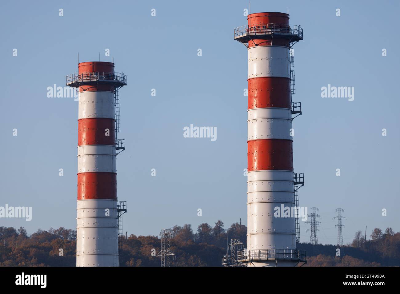 Power plant with two red and white pipes Environmentally friendly gas energy Stock Photo
