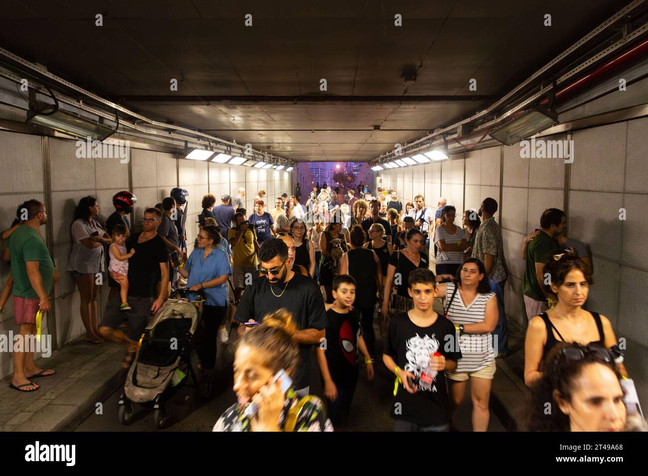 Tel Aviv, Israel - October 28, 2023 - Israeli civilians rushing into public shelters as the sirens go off during the ongoing Hamas-Israel war which st Stock Photo