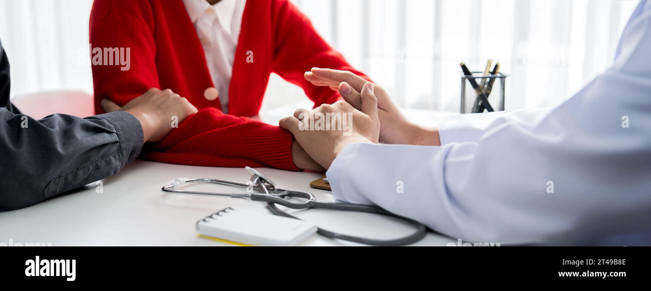 Couple attend fertility or medical consultation with gynecologist at hospital as family planning