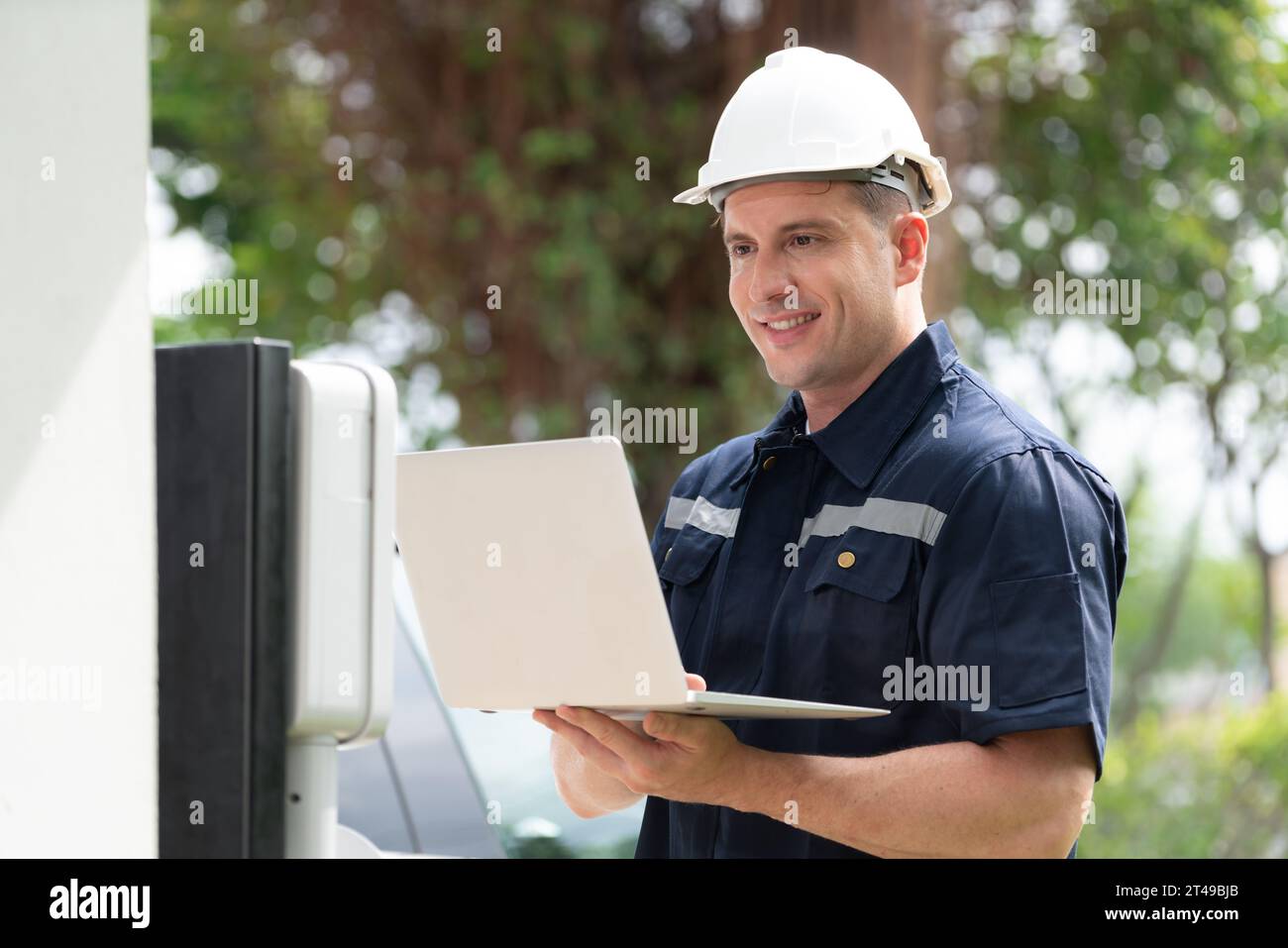 Qualified technician working on home EV charging station installation