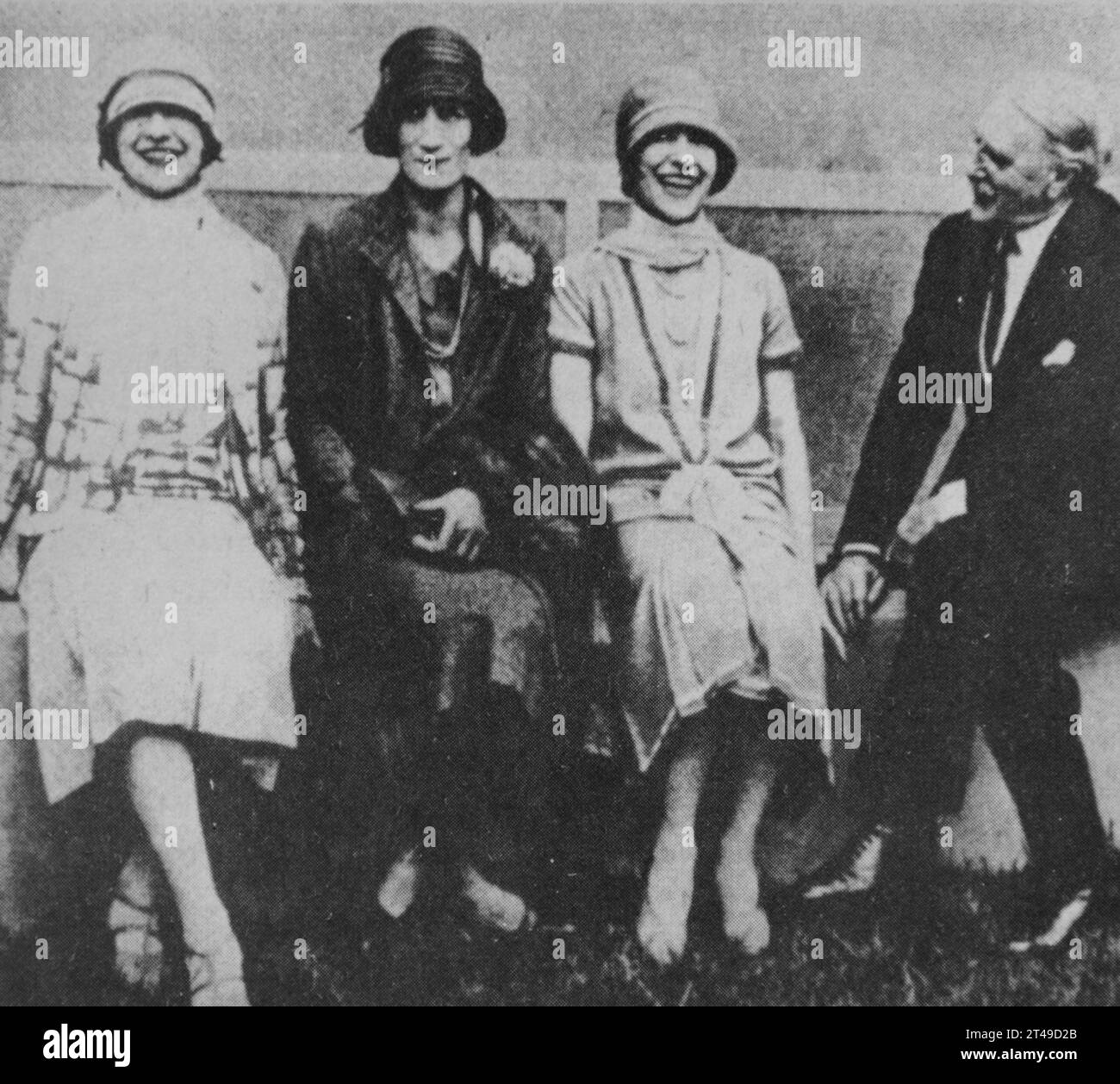 Gordon Selfridge, one of the most respected and wealthy retail magnates in the United Kingdom sitting with American stars 'The Dolly sisters'. Stock Photo