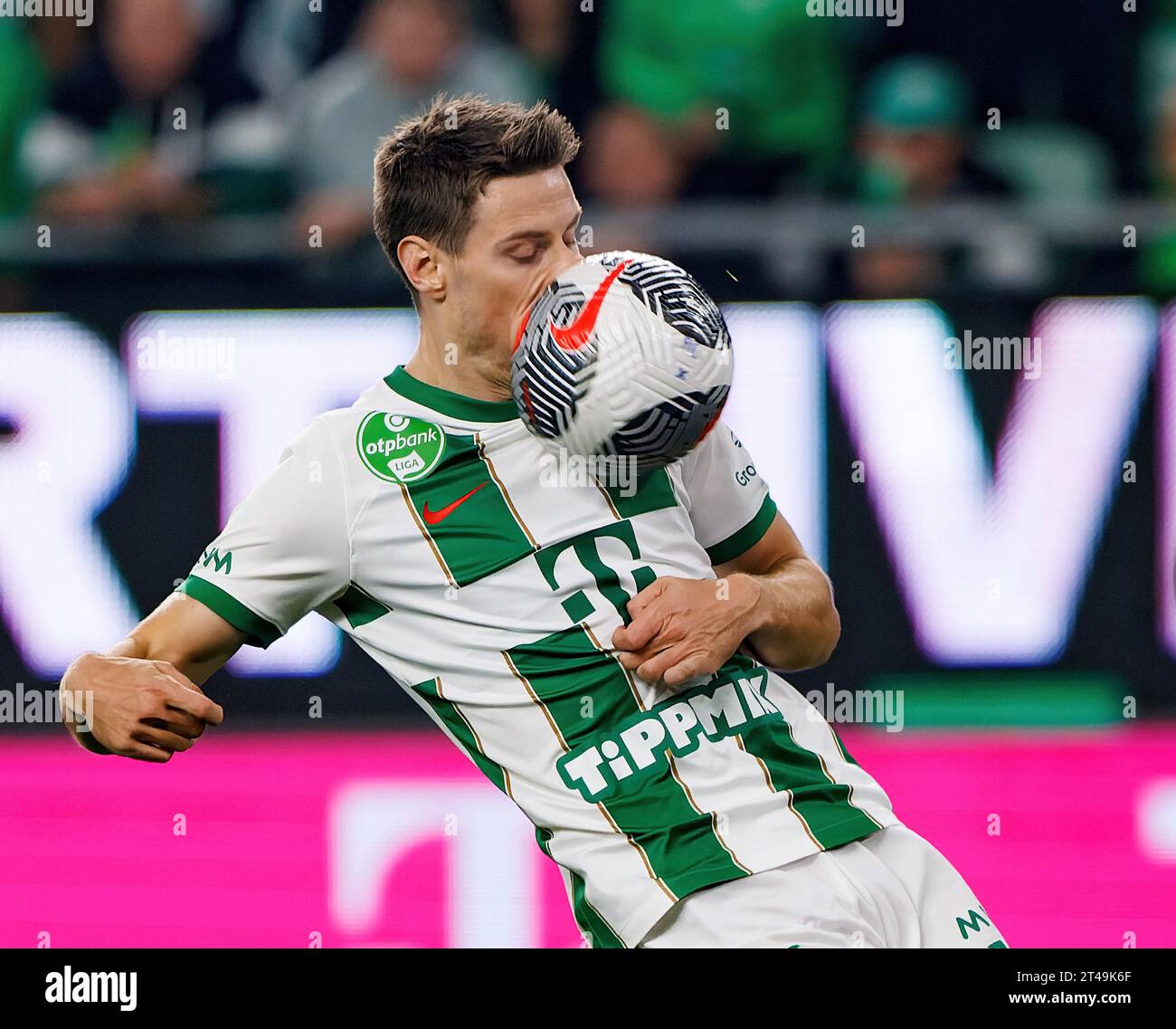 BUDAPEST, HUNGARY - MARCH 6: Claudiu Bumba of Kisvarda Master Good  challenges Henry Wingo of Ferencvarosi TC during the Hungarian OTP Bank  Liga match between Ferencvarosi TC and Kisvarda Master Good at