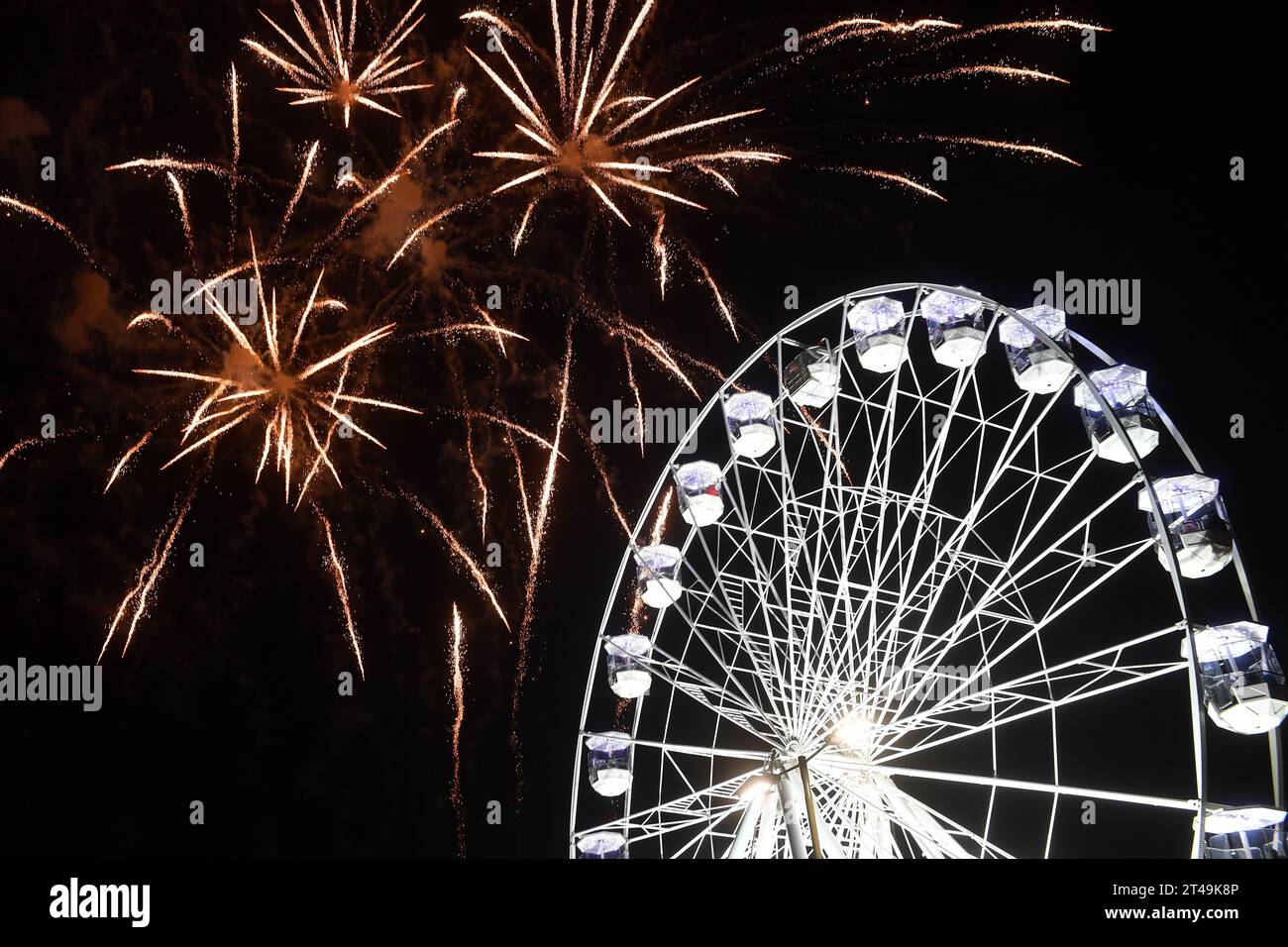 Leicester, UK. 29th Oct, 2023.   Fireworks light up the night sky over the Wheel of Light on The Golden Mile in Leicester during the Diwali Lights Switch on, marking the start of  Diwali 2023, the 40th year of the event in Leicester Credit: Alex Hannam/Alamy Live News Stock Photo