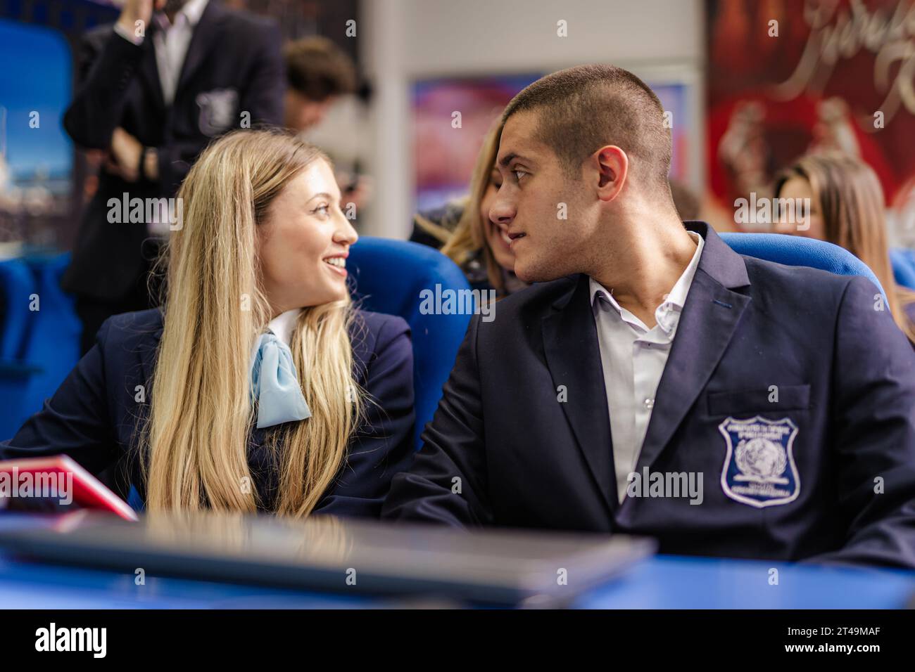 Students talking to their classmate in the back Stock Photo